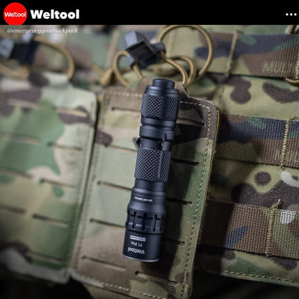 Weltool T1 Pro V3 EDC Flashlight 600 Lumens 313M flashlight on a tactical pouch with 'Weltool' branding.