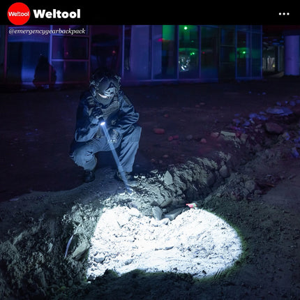 Weltool W7 in a dark outdoor setting.
