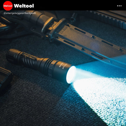 Weltool W7 Flashlight emitting light on a textured surface with 'Weltool' branding.