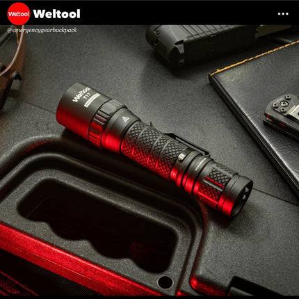 Weltool T17 flashlight on a textured surface with 'Weltool' branding.