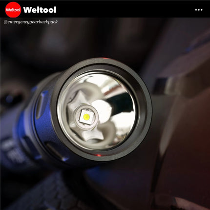 Close-up of a flashlight with Weltool branding in the corner.