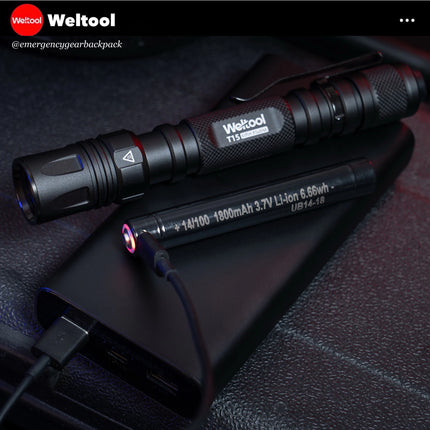 Weltool T15 penlight with 14/100 battery being charged via powerbank.   