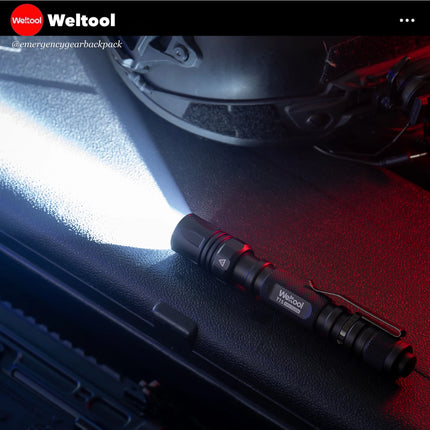 Flashlight on a car dashboard with Weltool branding