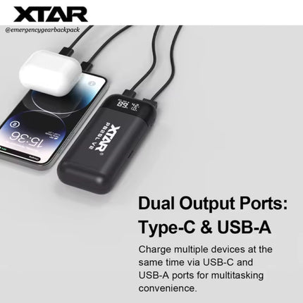 XTAR power bank with dual output ports charging a phone and earbuds on a light gray background.