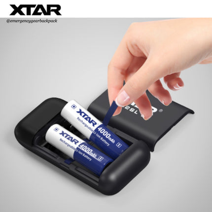 XTAR battery charger with two batteries being inserted on a gray background