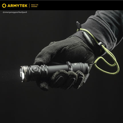 Dobermann Pro Max tactical flashlight held in a gloved hand during field operation
