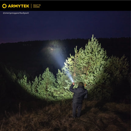 Long-range beam of Armytek Dobermann Pro Max illuminating a tree at night
