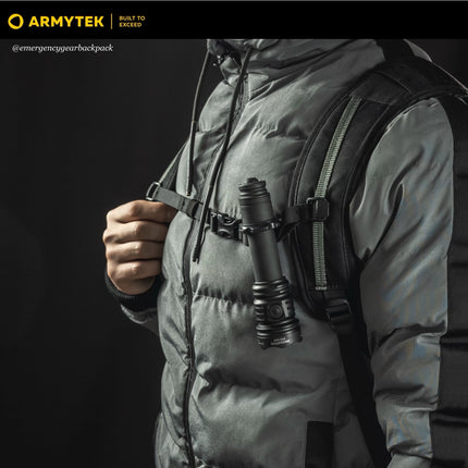 Armytek Predator Pro Max tactical flashlight carried on backpack strap for field use