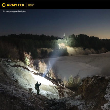 Armytek Predator Pro Max long range flashlight beam projection across open terrain