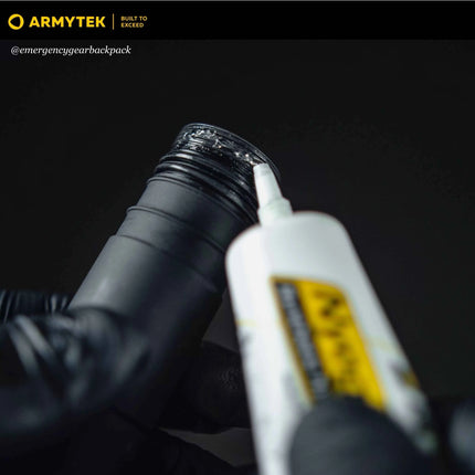 Flashlight tailcap and threads prepared for lubrication with Armytek NyoGel 760G
