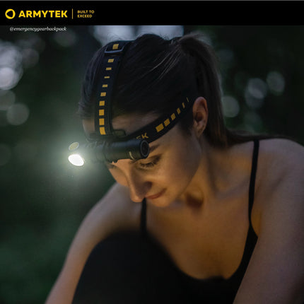 Woman using Armytek Wizard C2 Pro Max LR Warm flashlight as headlamp for outdoor activity