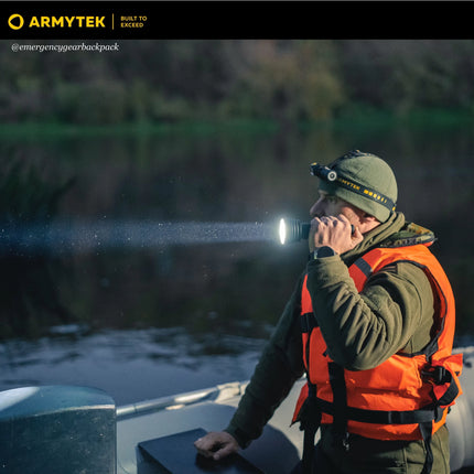 Armytek Barracuda Pro Max searchlight used by rescuer during night operation
