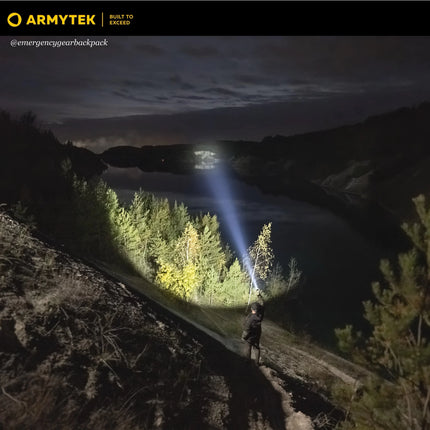 Armytek Barracuda Pro Max long distance illumination across mountain landscape
