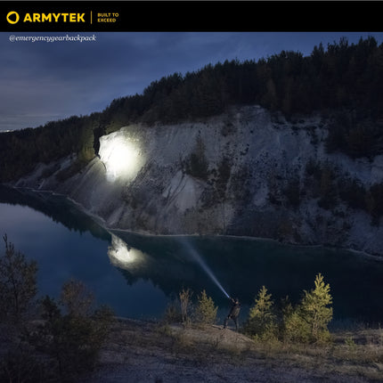 Armytek Barracuda Pro Max long distance illumination across mountain landscape
