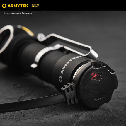 Armytek flashlight charging via AMC-02 magnetic charger on desk