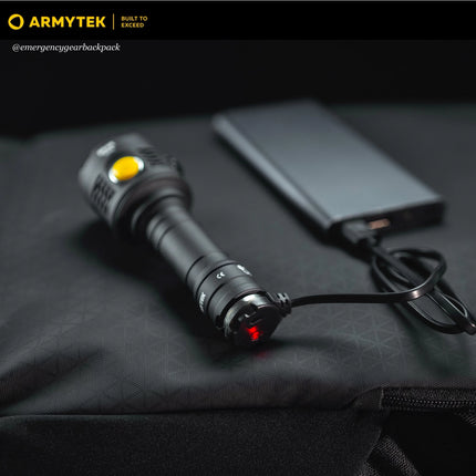 Armytek AMC-02 magnetic charger used with tactical flashlight in field setup